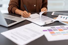 Documents arranged neatly on a desk with application form.